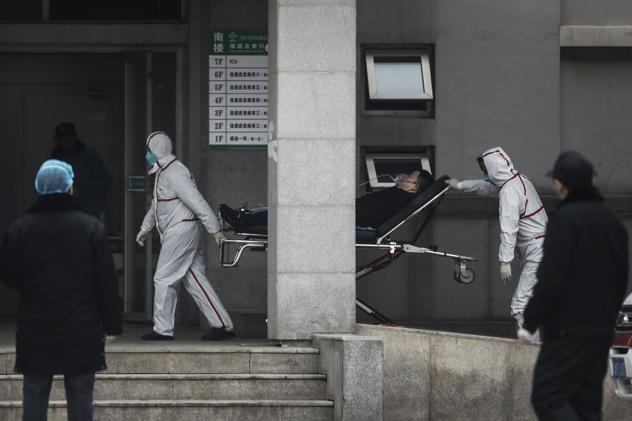 Chinese officials urge people not to travel in and out of city at center of virus outbreak